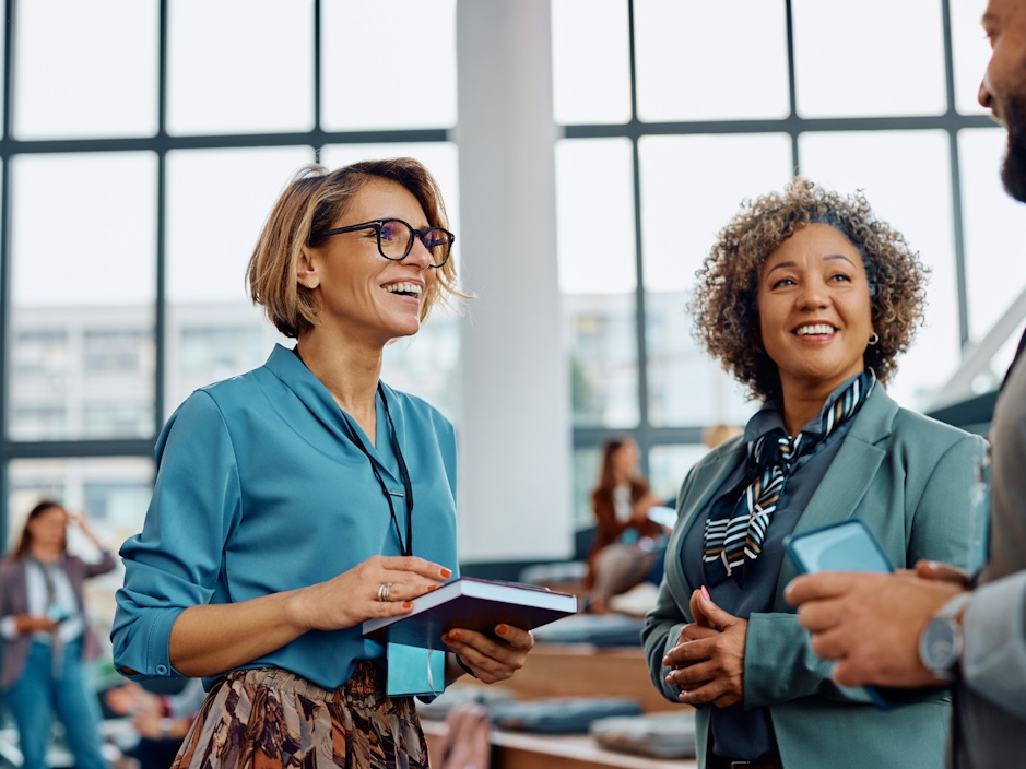 Stock image of people networking at a conference